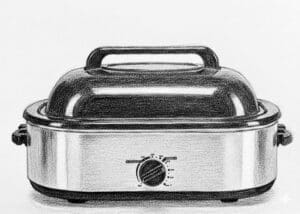 Electric roaster oven with black lid.